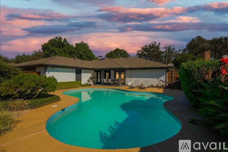 A house with a pool in the backyard.
