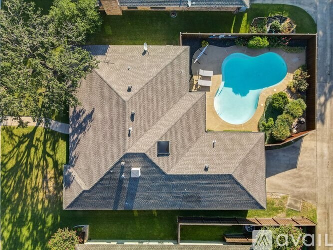 A house with a swimming pool in the backyard.