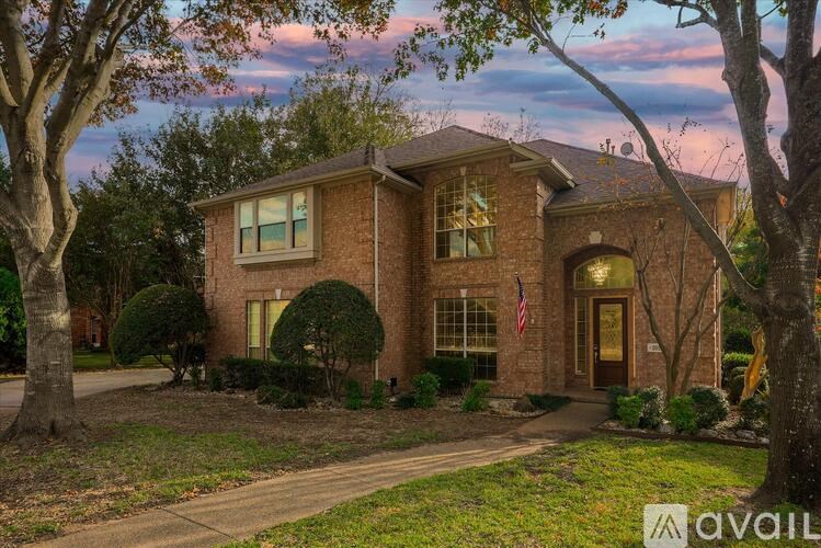 A house with a flag on the front porch is available for sale.