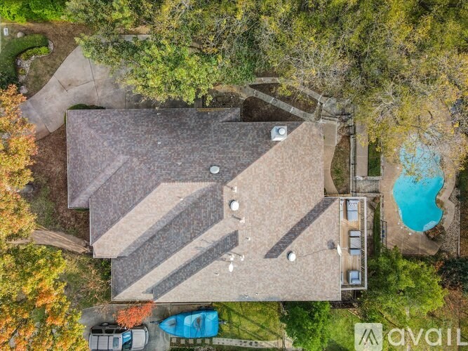 A house with a pool and a carport is for sale.