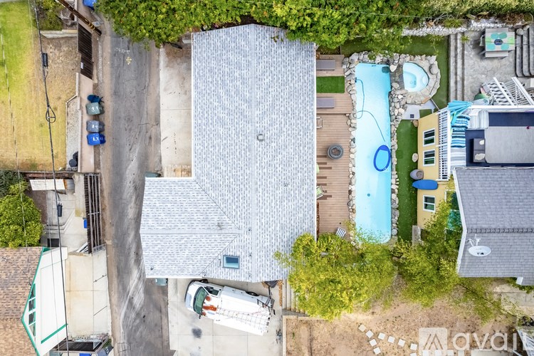 A bird's eye view of a house with a swimming pool.