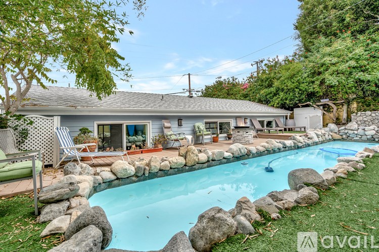 A house with a pool in the backyard.