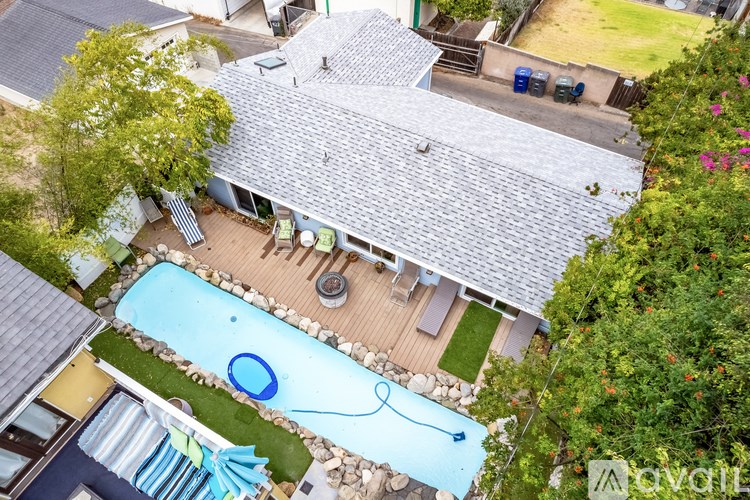 A house with a pool in the backyard.