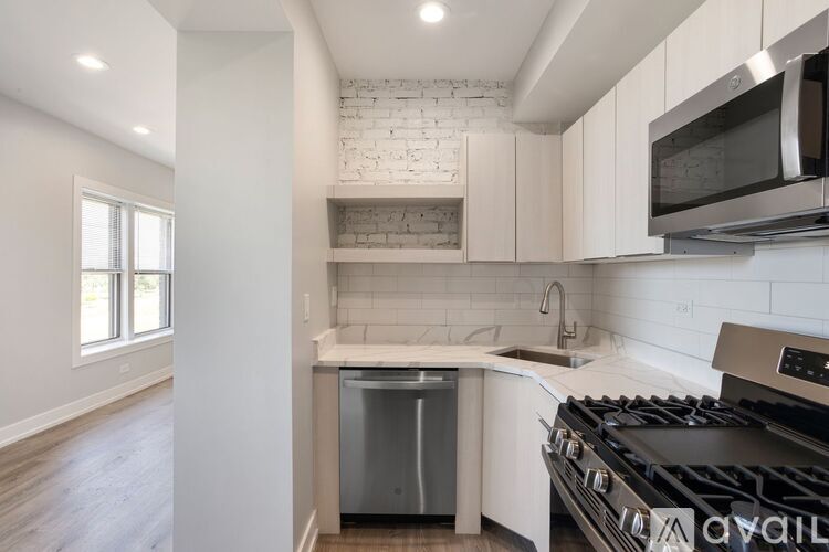 A kitchen with a stove top oven and a dishwasher.