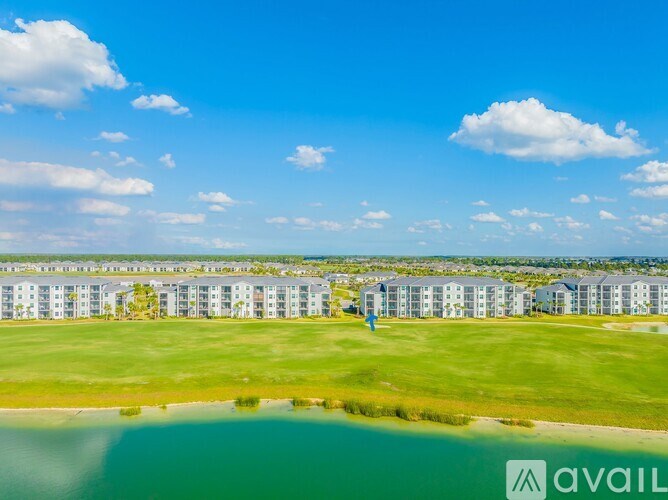 A row of houses with a blue sky and clouds above.