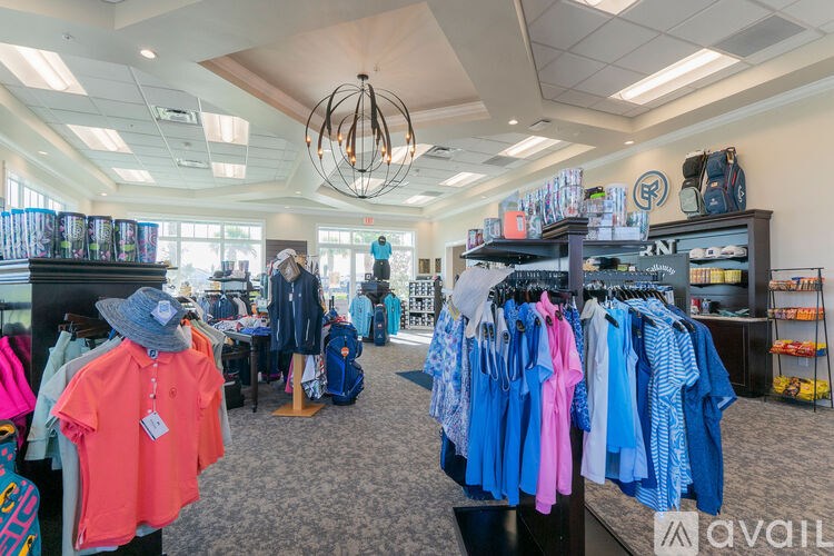 A clothing store with various items on display.