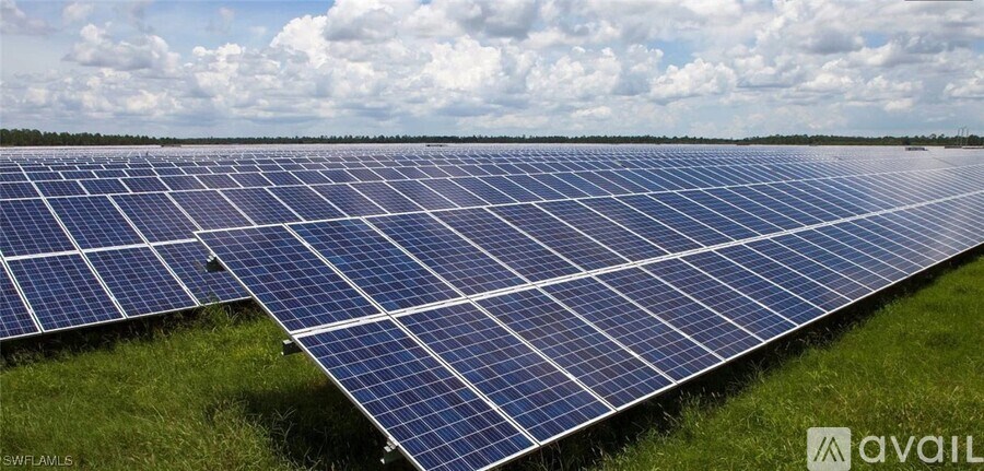 A large solar farm with rows of solar panels.