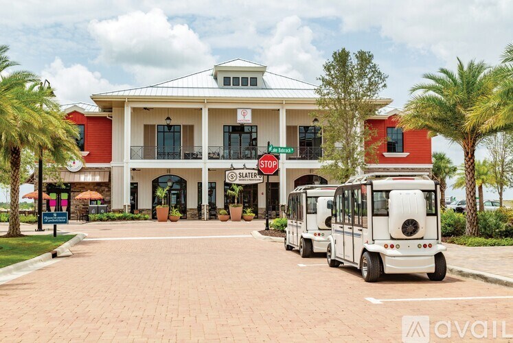 A red and white building with a stop sign in front of it.