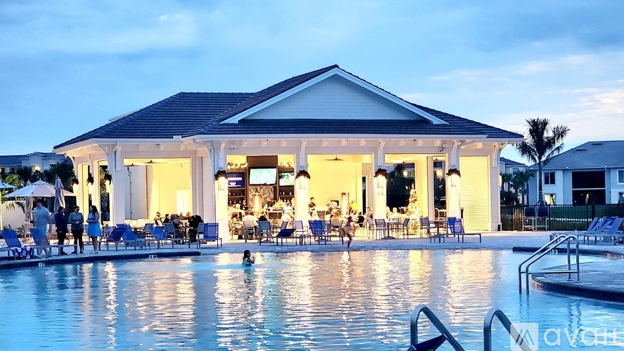 A large house with a pool in front of it.