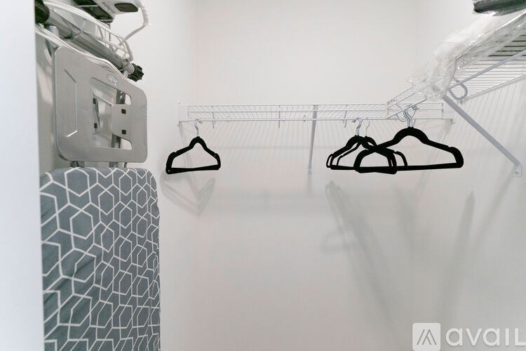 Two hangers are shown on a clothes rack.