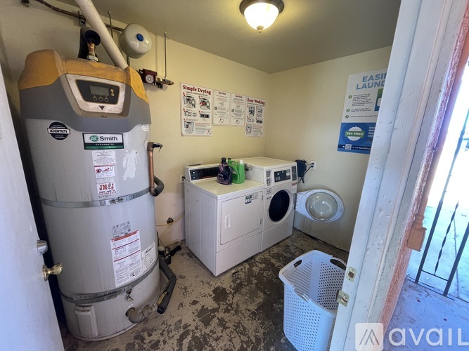 A laundry room with a washer and dryer.