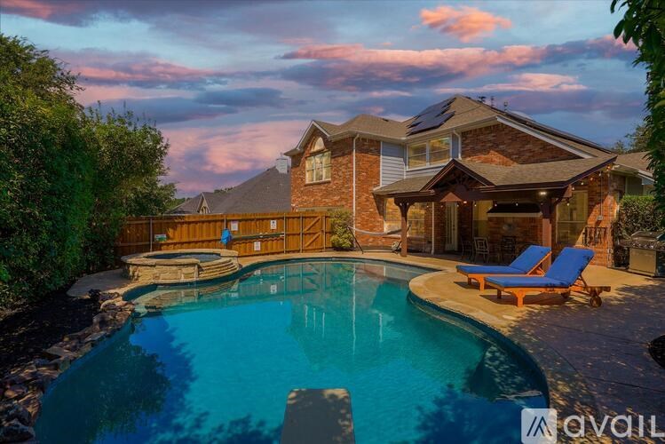 A house with a pool in the backyard.