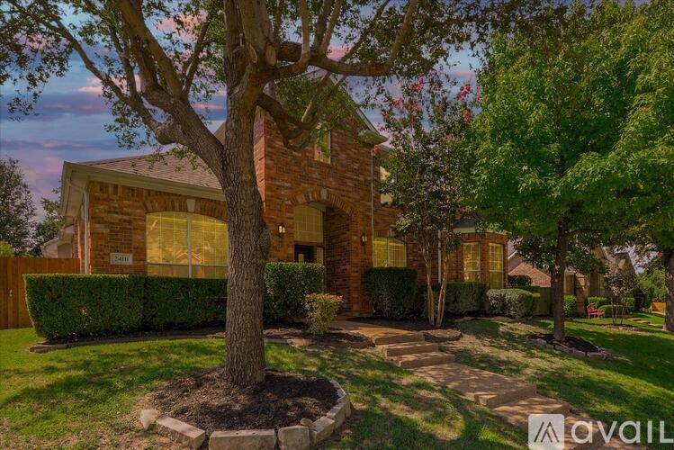 A house with a tree in front of it.