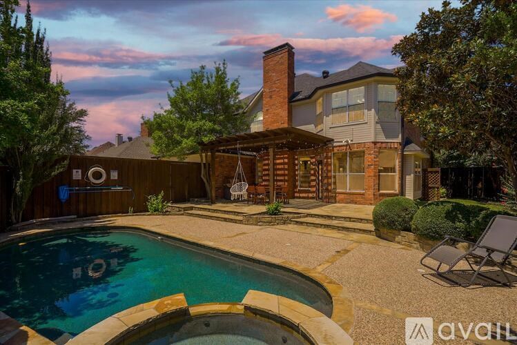 A house with a pool in the backyard.