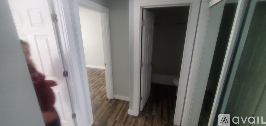A room with a doorway leading to another room.