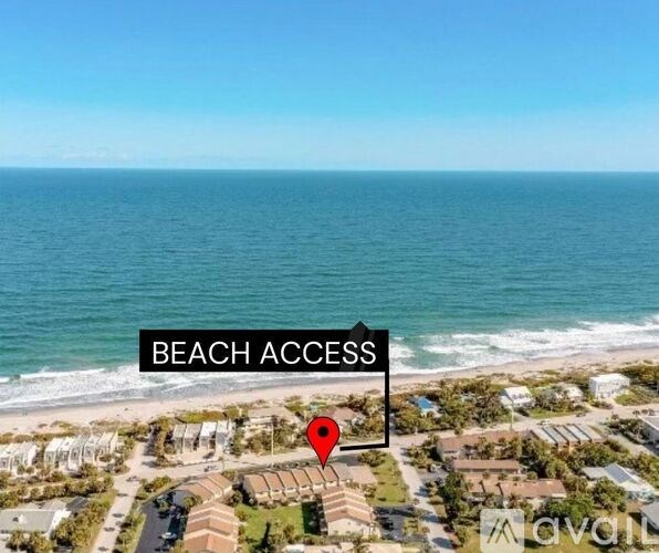 An aerial view of a beachfront property with a label indicating beach access.