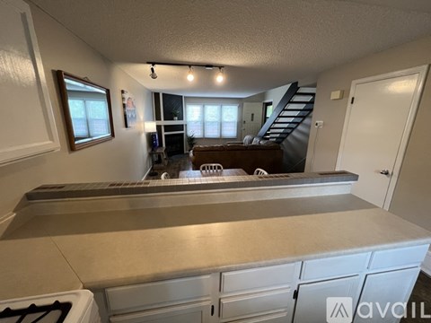 A kitchen with a stove top oven and a counter top.