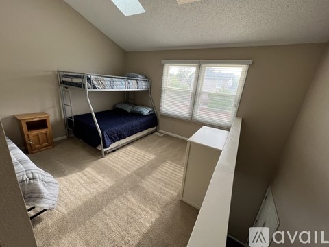 A bedroom with a bunk bed and a single bed.