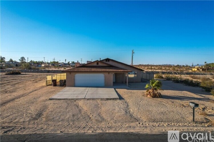 A house with a garage is for sale.