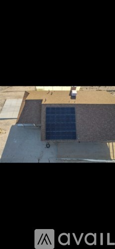 A solar panel is installed on the roof of a building.