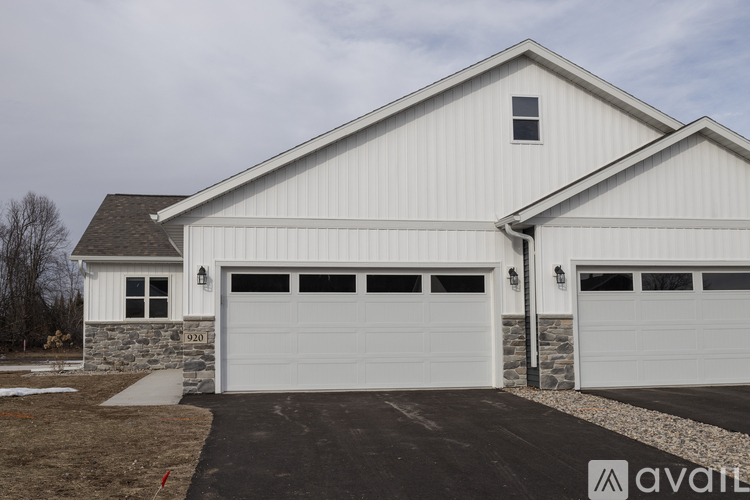 A two-car garage is attached to a house.