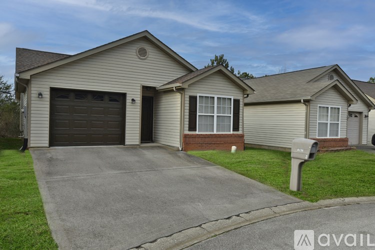 A two-story house with a garage is available for rent.