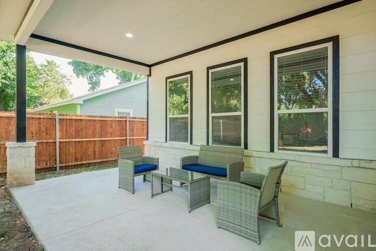 A patio with a table and chairs is available for rent.