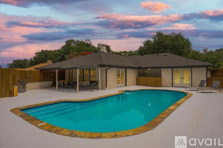 A house with a pool in the backyard.