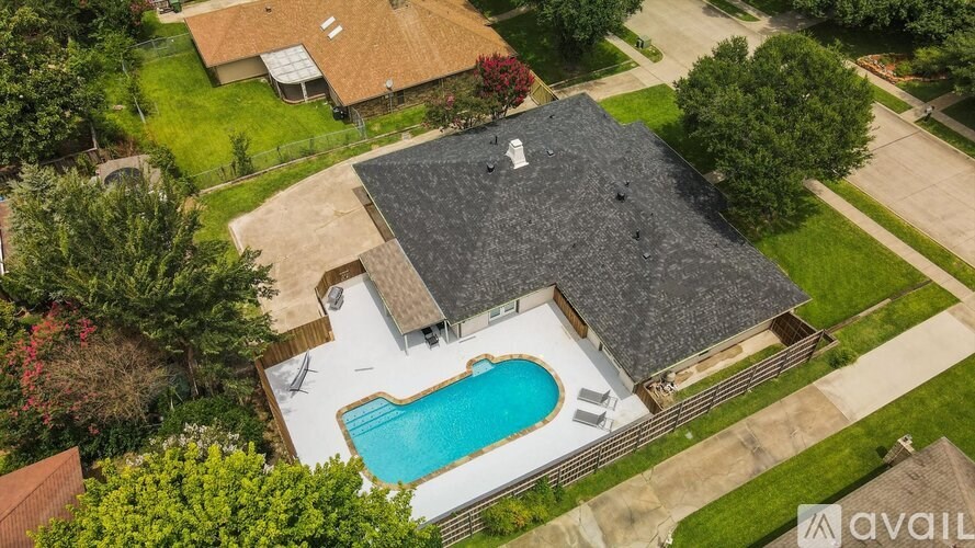 A house with a pool in the backyard.