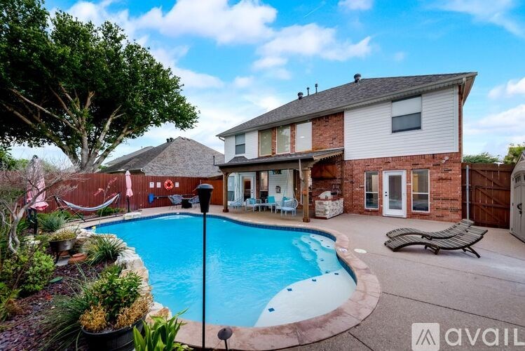 A house with a pool in the backyard.