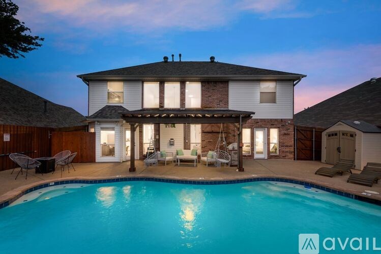 A house with a pool in the backyard.