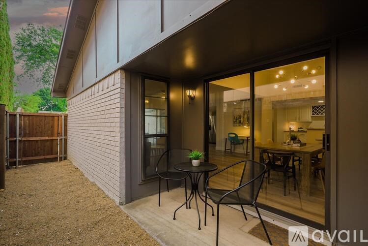 A patio with a table and chairs is shown in the image.
