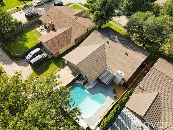 A house with a pool in the backyard.