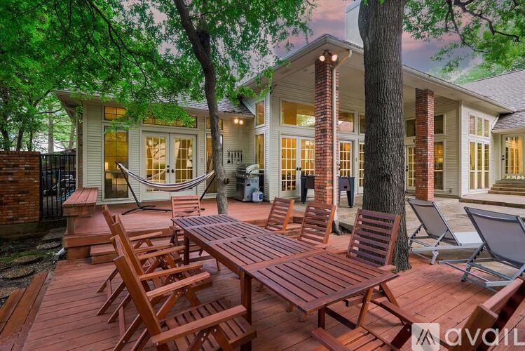 A house with a hammock on the porch.