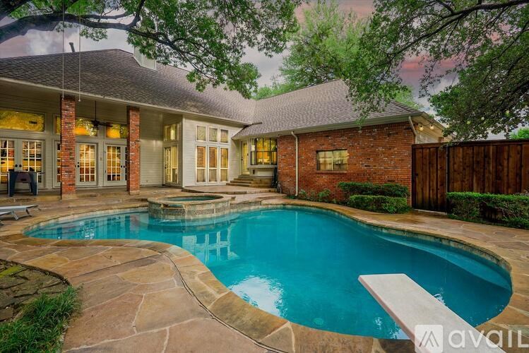A house with a pool in the backyard.