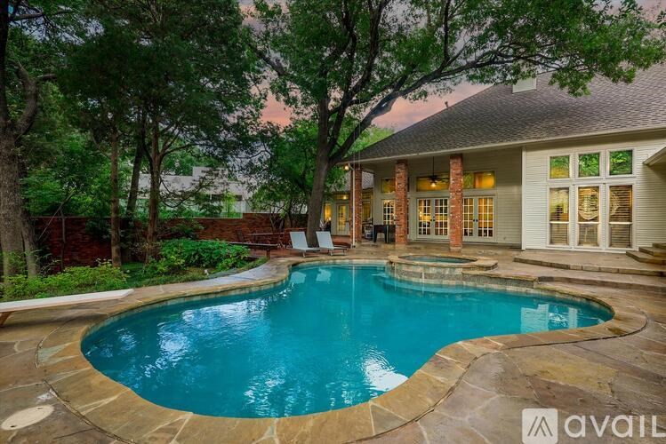 A house with a pool in the backyard.