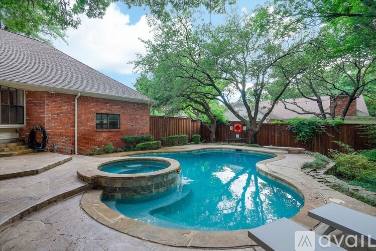 A backyard with a small pool and a hot tub.