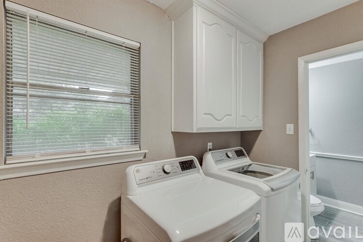 A laundry room with a washer and dryer.