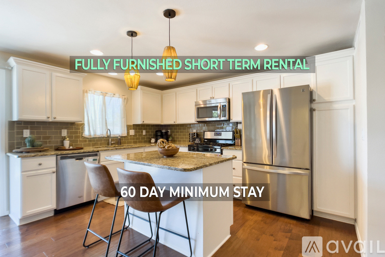 A fully furnished short term rental kitchen with a 60 day minimum stay.
