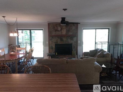 A living room with a fireplace and a couch.