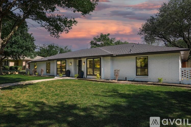 A house with a lawn in front of it is available for sale.