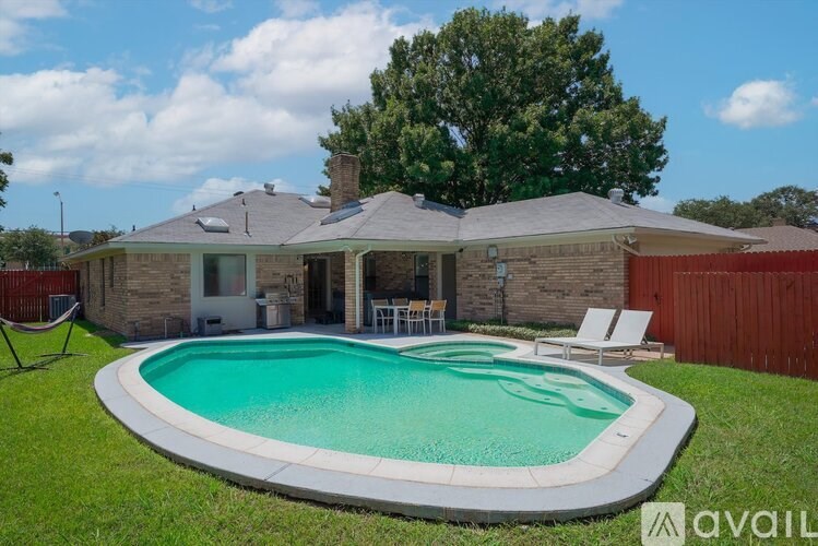 A house with a pool in the backyard.