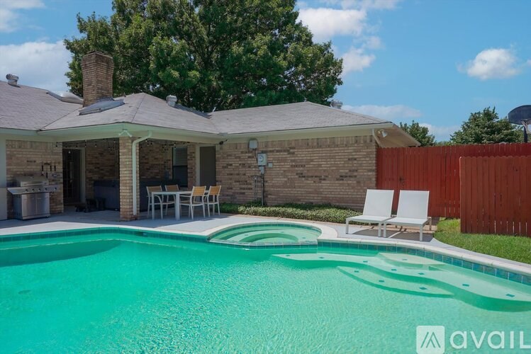 A house with a pool in the backyard.