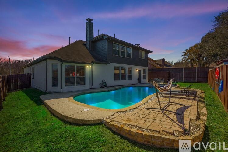 A house with a pool in the backyard.