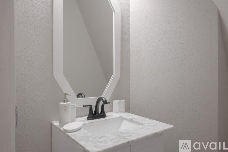A bathroom sink with a mirror above it.