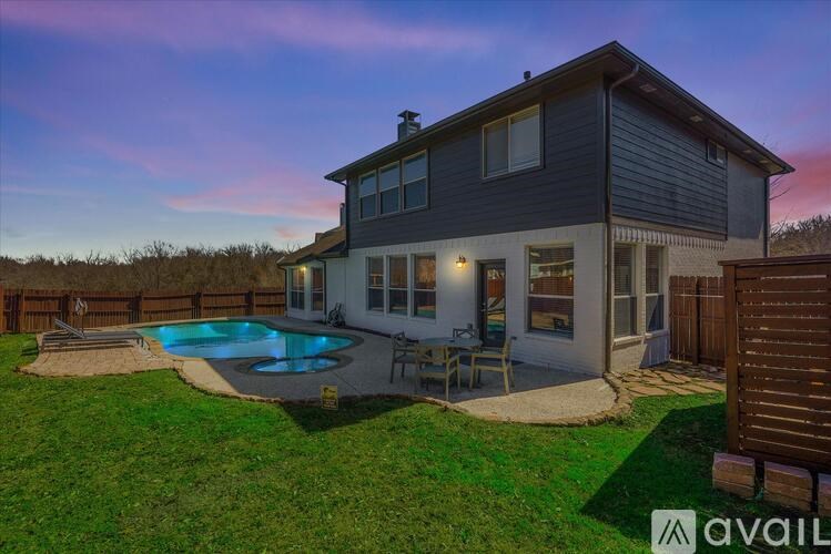 A house with a pool in the backyard.