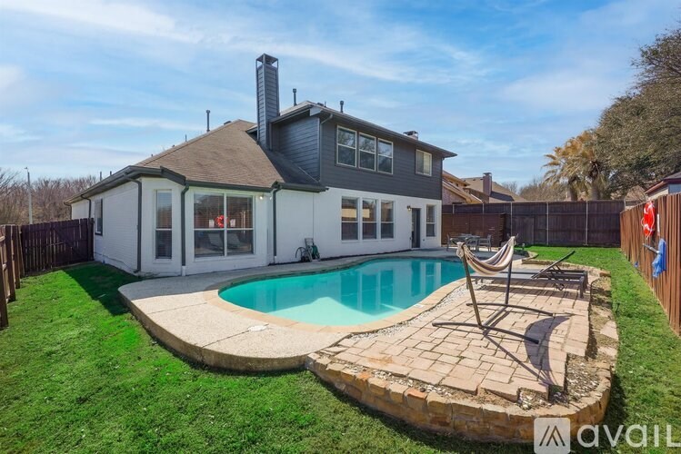 A house with a pool in the backyard.