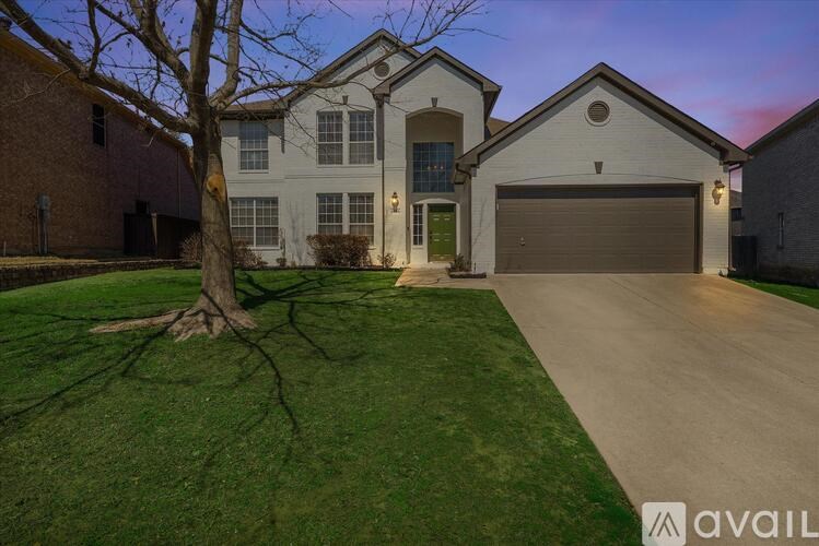 A house with a tree in front of it.