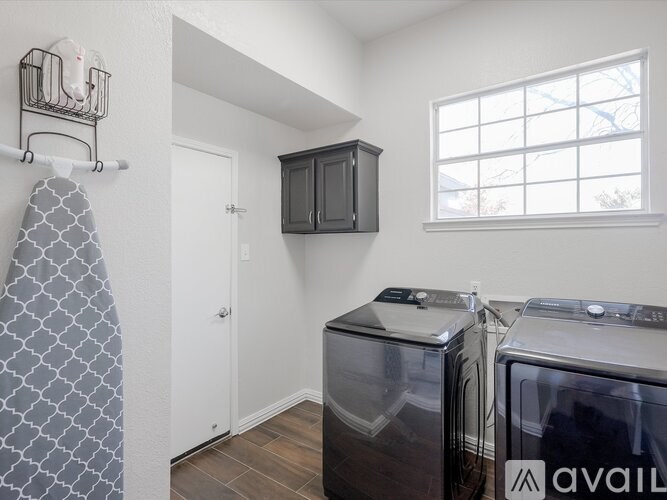 A laundry room with a washer and dryer.