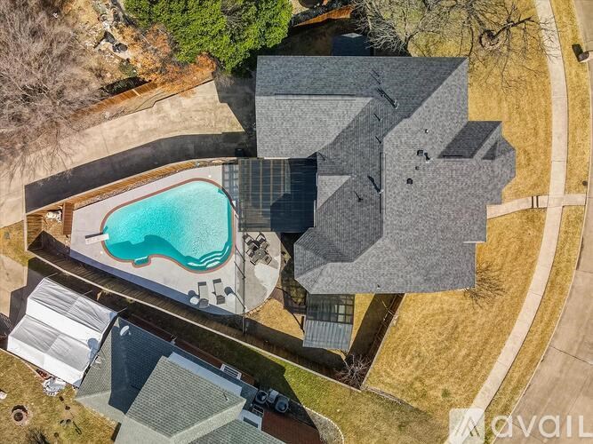 A house with a pool in the backyard.